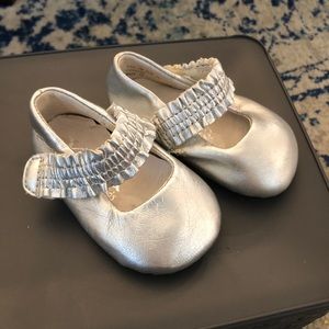 Silver baby shoes